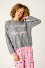 Load image into Gallery viewer, Model wearing grey knit pullover sweater with pink Cupcakes and Champagne script lettering
