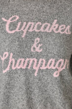 Load image into Gallery viewer, Close-up detail of grey knit sweater with pink script reading Cupcakes and Champagne