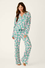 Load image into Gallery viewer, Model wearing long sleeve button-front pajama set with green stripe and mahjong tile print