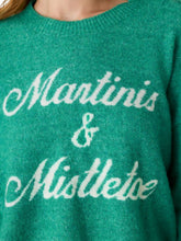 Load image into Gallery viewer, Close-up detail of green knit sweater with cursive Martinis and Mistletoe lettering