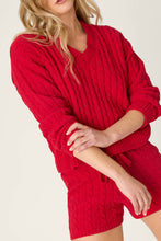 Load image into Gallery viewer, Model wearing red cable knit long sleeve sweater with matching shorts, arms crossed