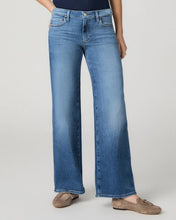 Load image into Gallery viewer, Woman wearing wide-leg low-rise medium wash jeans paired with tan suede loafers