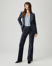 Load image into Gallery viewer, Model wearing paisley velvet flare trousers with matching blazer and light blue blouse