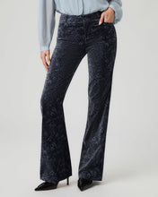Load image into Gallery viewer, Model wearing navy velvet flare trousers with paisley pattern and light blue blouse