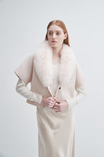 Load image into Gallery viewer, Model wearing short sleeve wool jacket with oversized fur collar in ivory, styled over matching skirt