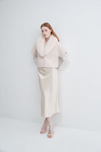 Load image into Gallery viewer, Model wearing a short-sleeve jacket with fluffy fur collar styled over a satin midi skirt