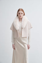 Load image into Gallery viewer, Model wearing a cropped short-sleeve jacket with fluffy white fur collar over a maxi skirt