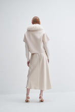 Load image into Gallery viewer, Back view of model wearing short sleeve jacket with fur collar and matching midi skirt