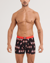 Load image into Gallery viewer, Male model wearing black Saxx boxer briefs with holiday gnome print and red waistband