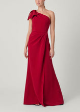 Load image into Gallery viewer, One-shoulder floor-length gown with bow detail and draped skirt on model