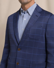 Load image into Gallery viewer, Men's navy windowpane blazer with notch lapel, brown buttons, and chest pocket detail