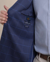 Load image into Gallery viewer, Interior lining detail of a navy windowpane blazer showing Southern Tide brand label and inner pocket