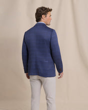 Load image into Gallery viewer, Back view of male model wearing navy windowpane blazer with light trousers