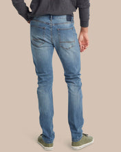 Load image into Gallery viewer, Back view of men's slim fit medium wash denim jeans with five-pocket styling