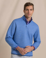 Load image into Gallery viewer, Male model wearing quilted reversible quarter-snap pullover layered over plaid button-down shirt