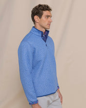 Load image into Gallery viewer, Man wearing a quilted quarter-snap pullover layered over a collared shirt, side view