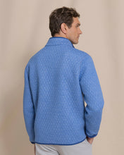 Load image into Gallery viewer, Man wearing quilted reversible snap pullover, shown from back, displaying diamond quilt pattern