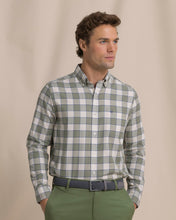 Load image into Gallery viewer, Man wearing long sleeve plaid button-down sport shirt with green chinos and woven belt