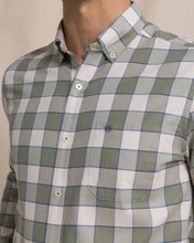 Load image into Gallery viewer, Close-up detail of men's long sleeve plaid button-down shirt with chest pocket and logo embroidery