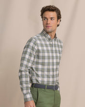 Load image into Gallery viewer, Man wearing long sleeve green and white plaid button-down sport shirt with green chinos