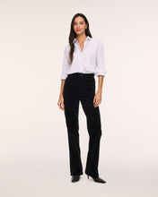 Load image into Gallery viewer, Model wearing black corduroy bootcut jeans with white striped button-down shirt and black heels