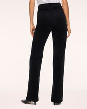 Load image into Gallery viewer, Back view of women's black corduroy bootcut jeans with patch pockets on model