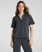Load image into Gallery viewer, Woman wearing a short-sleeve button-down collared shirt with matching wide-leg pants
