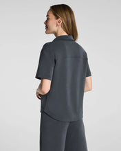Load image into Gallery viewer, Back view of woman wearing short-sleeve button-down shirt with matching wide-leg pants