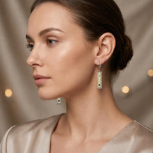 Load image into Gallery viewer, Model wearing rectangular vintage-style drop earrings with ornate detailing on each ear