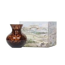 Load image into Gallery viewer, Juliska tortoiseshell glass vase with rounded body beside illustrated brand gift box
