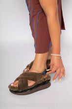 Load image into Gallery viewer, Model wearing fluffy cross-strap platform sandals with chunky brown sole, adjusting strap