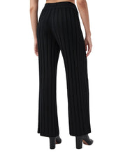 Load image into Gallery viewer, Back view of wide-leg ribbed knit pants with elastic waistband worn with black heels