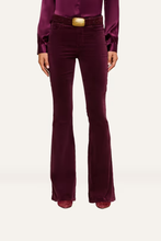 Load image into Gallery viewer, Women's high-rise velvet flare pants with gold belt buckle and matching satin blouse