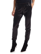 Women's black sequin jogger pants with tapered leg and elastic waist